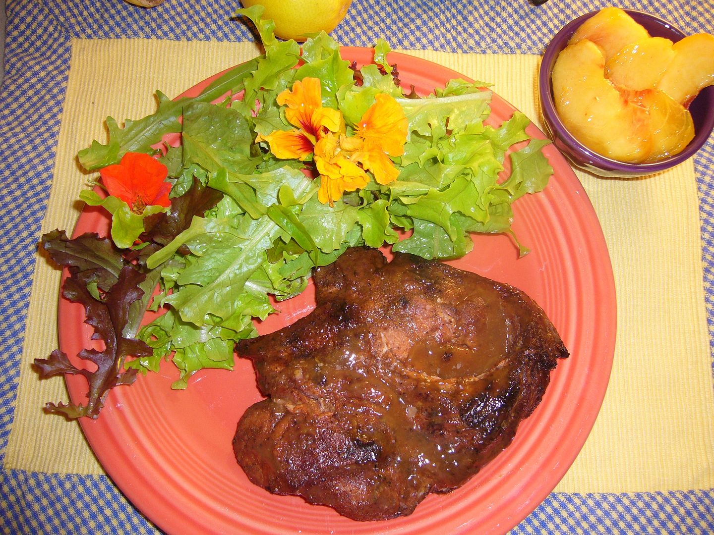 Grilled pork, green salad and super-ripe peaches