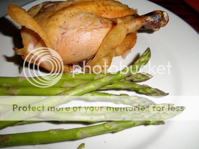 Chicken roasted in Bacon fat stuff with onions and celery and roasted asparagus