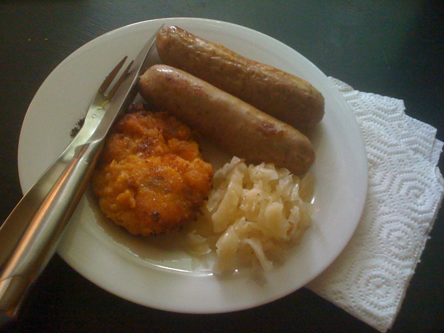 Preservative-free, hormone-free chicken sausages, mashed sweet potatoes, and homemade sauerkraut