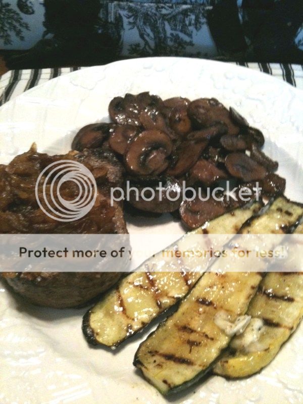Filet of beef, grilled and topped with caramelized onions with Grilled zucchini squash and Button mushrooms sautéed in butter with a red wine reduction